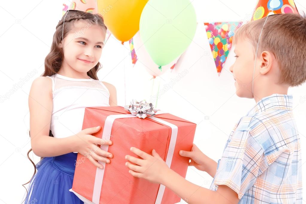 Boy and girl giving present