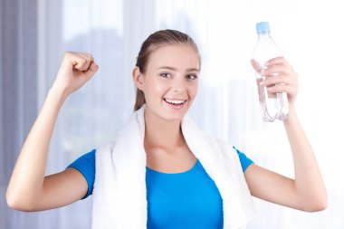 Pleasant girl drinking water  clipart