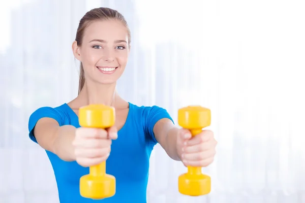 Happy girl doing exercises — Stock Photo, Image
