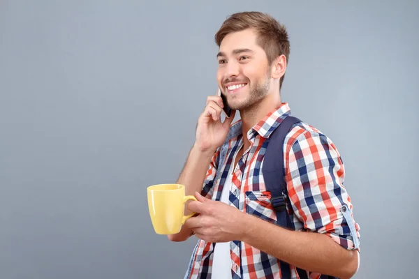 Cheerful student drinking tea — Stock Photo, Image