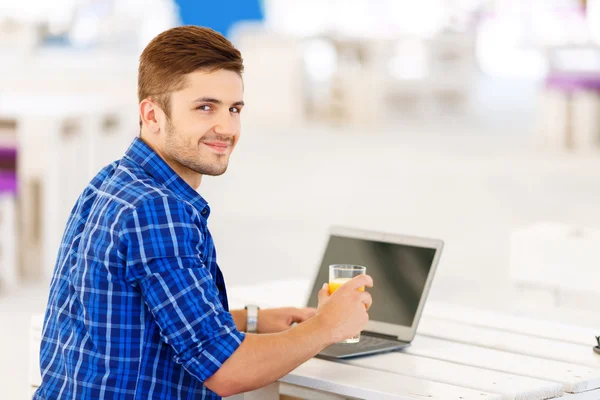 Positive freelancer working on the  laptop — Zdjęcie stockowe