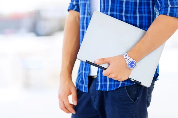 Nice freelancer holding   laptop — Stock fotografie