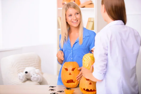 Contented  woman craving the pumpkin — Stock Photo, Image