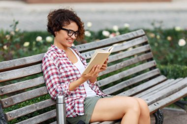Nice girl sitting on the bench