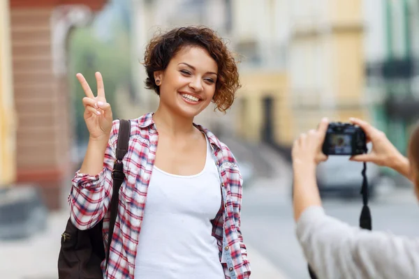 Smiling girl making photos — Stock Photo, Image