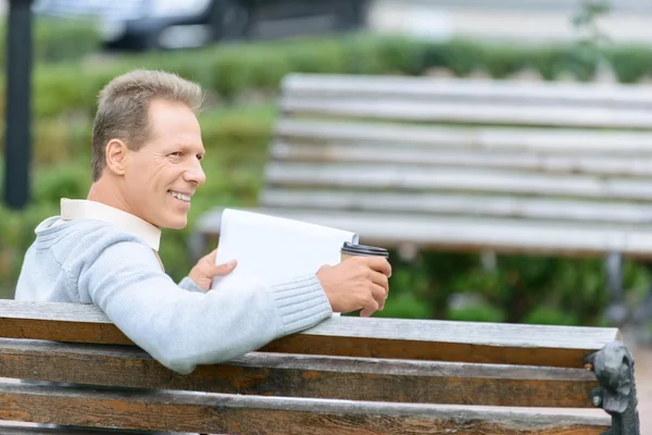Nice man waiting on the bench — Stock Photo, Image
