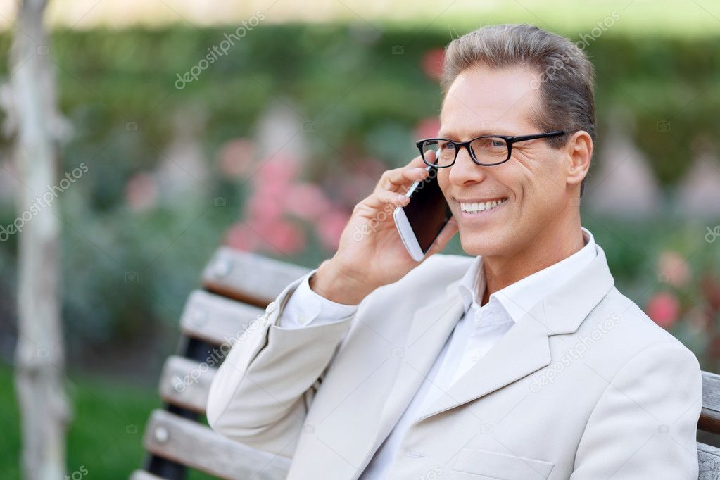 Pleasant man talking on phone