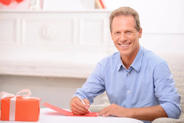 Adult man writing a letter. — Stockfoto