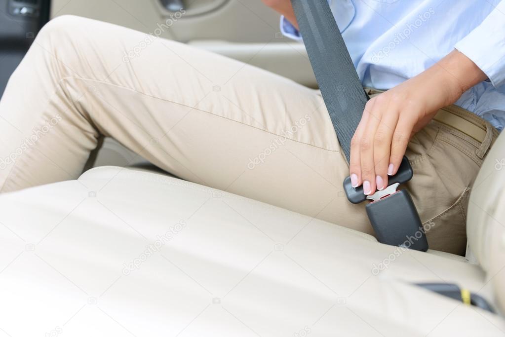 Nice girl sitting in the car