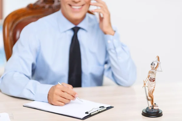 Professional lawyer sitting at the table — Stock Photo, Image