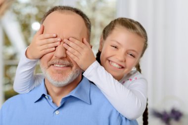 Grandfather sitting with his grandchild