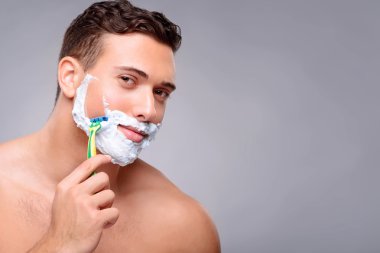 Pleasant guy shaving clipart