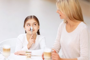Friendly family sitting in the cafe