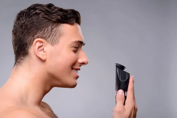 Handsome guy taking care of himself — Stock Photo, Image