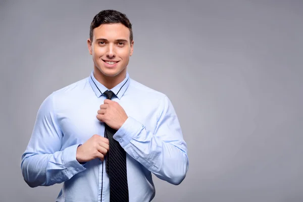 Pleasant man getting dressed — Stockfoto