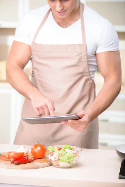 Tough-looking guy in the kitchen — Stock Photo, Image