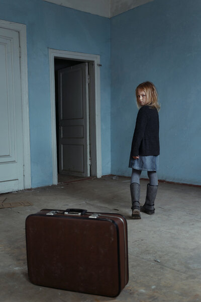 Miserable girl leaving the room