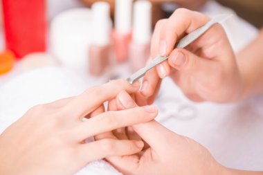 Professional manicurist  making manicure