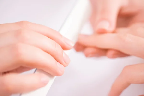 Professional manicurist  making manicure — Stock Photo, Image