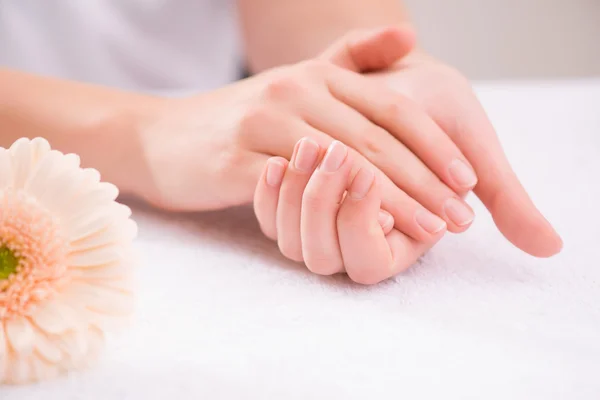 Pleasant woman making hand massage — Stockfoto