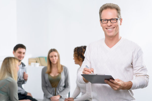 Psychologist working with group of people