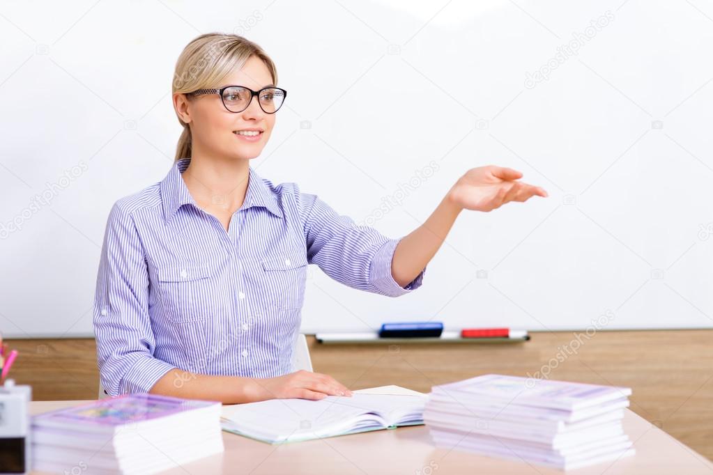 Teacher sitting at the desk