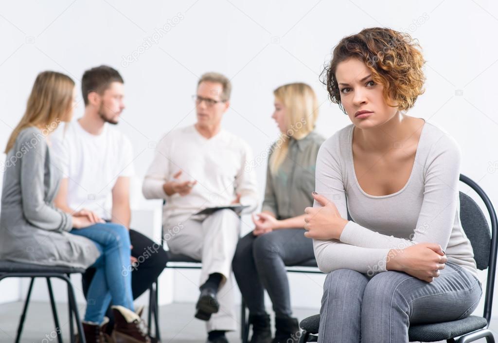 Psychologist working with group of people Stock Photo by ©yacobchuk1 91529780