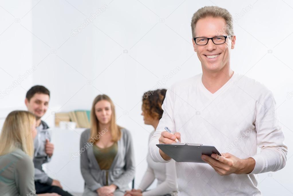 Psychologist working with group of people