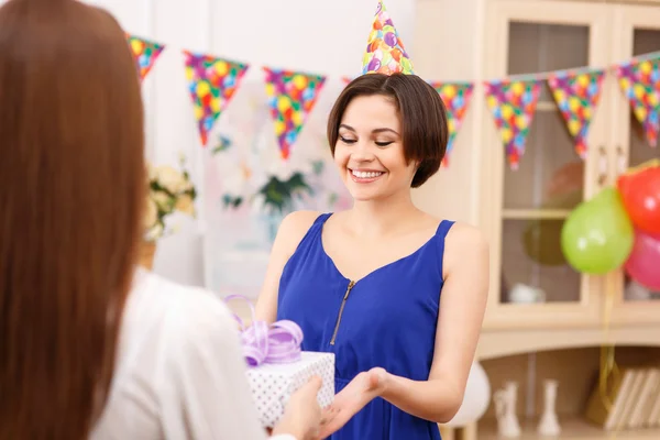 Birthday girl receiving present — Stock Photo, Image