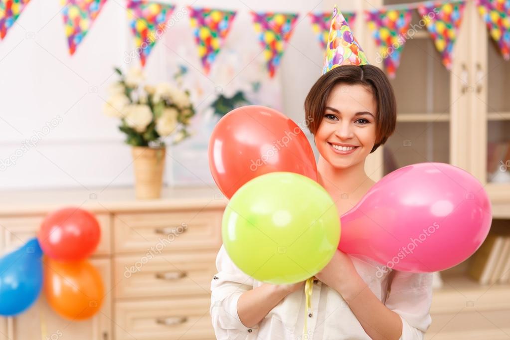 Young girl with colorful balloons