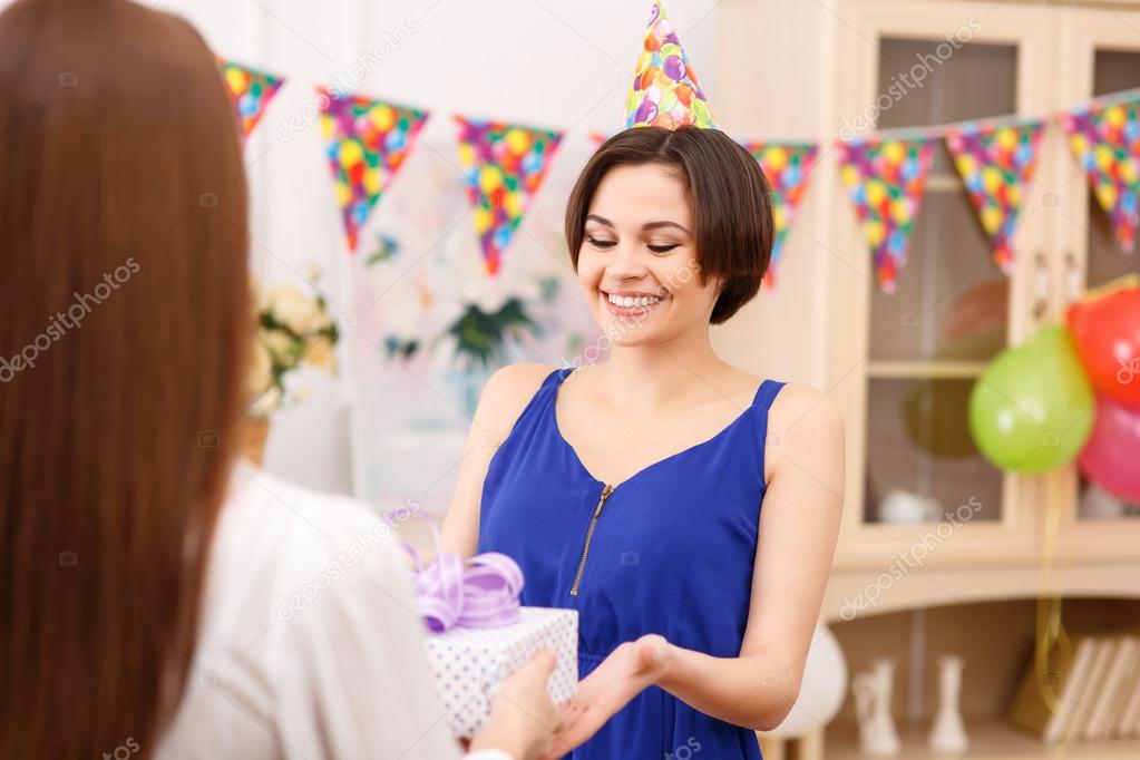 Birthday girl receiving present