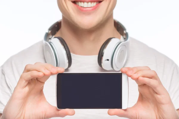 Stilig man med hörlurar och smartphone. — Stockfoto