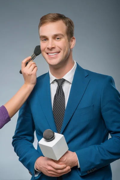 Smiling newscaster is being groomed — Stock Photo, Image