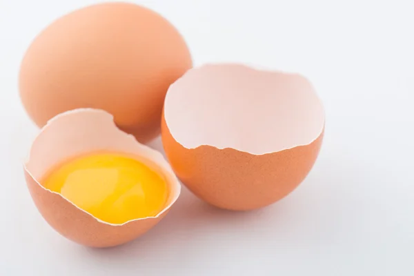 Chicken eggs are on white surface. — Stock Photo, Image