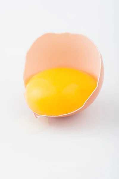 Half of egg with running yolk — Stock Photo, Image