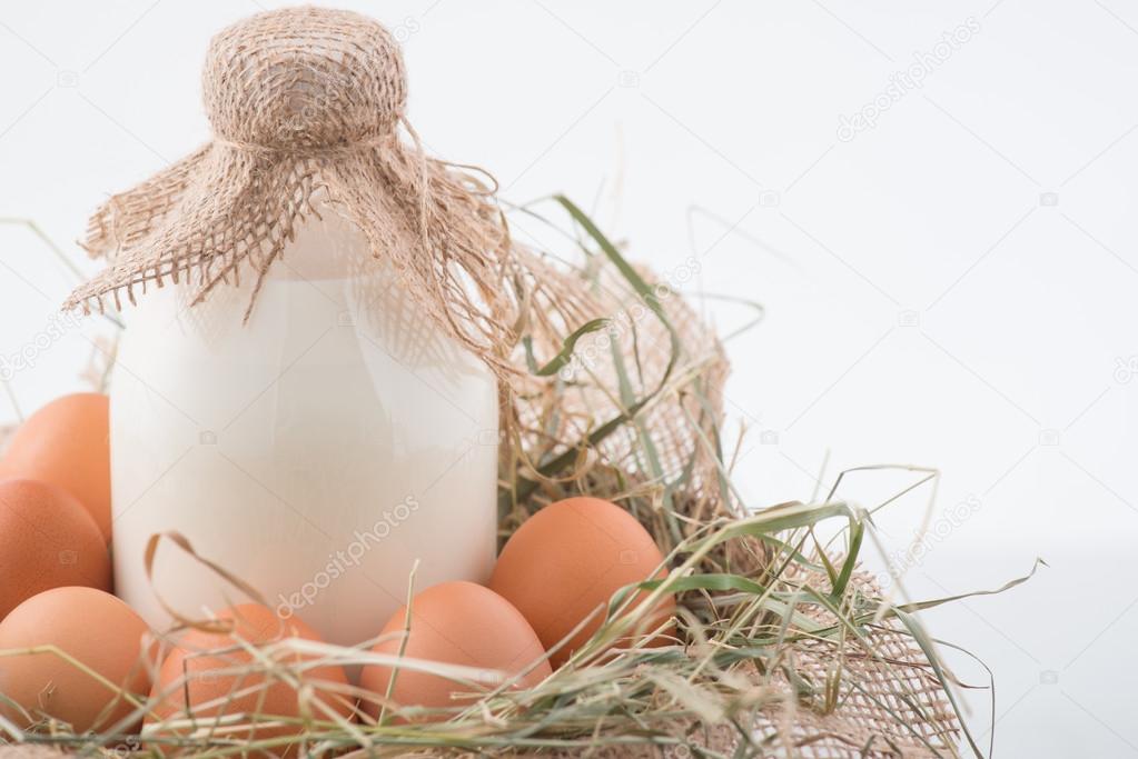 Eggs and milk are in decorative nest.