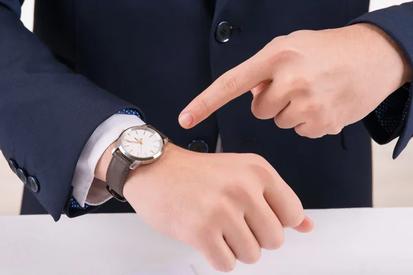 Man pointing at the wristwatch. — Stock Photo, Image