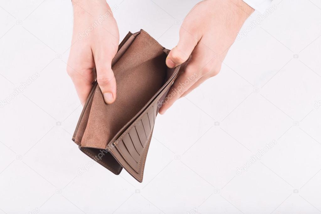 Male hands demonstrating an empty wallet.
