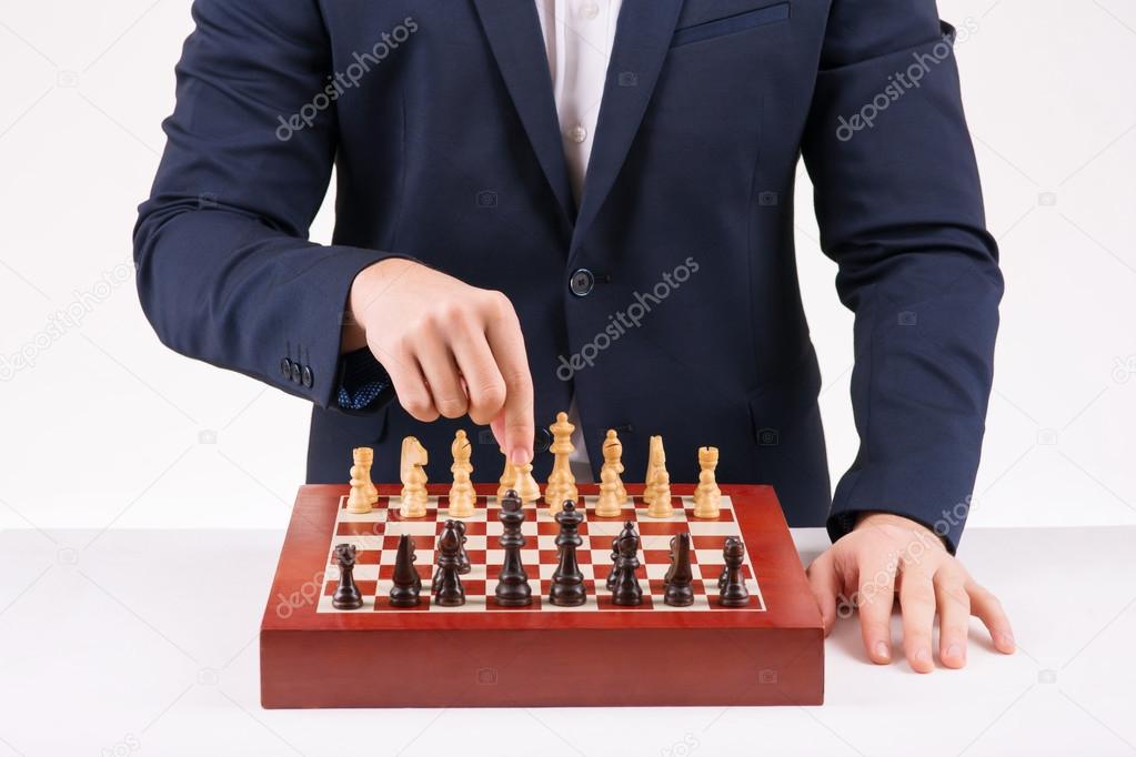 Person playing chess game.