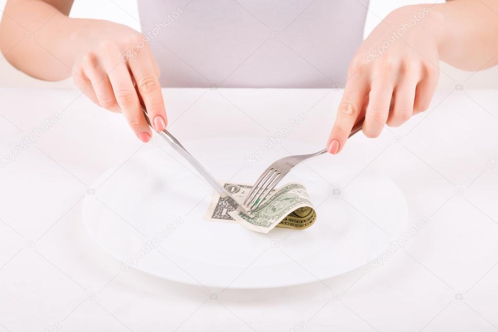 Woman with dinnerware and one dollar.