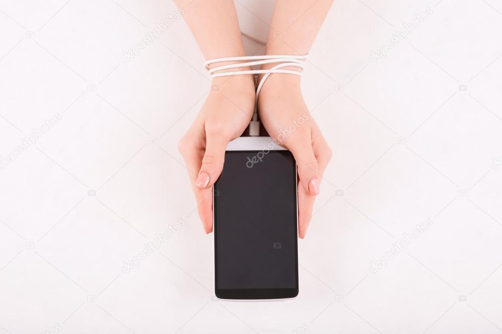 Female hands with smartphone.