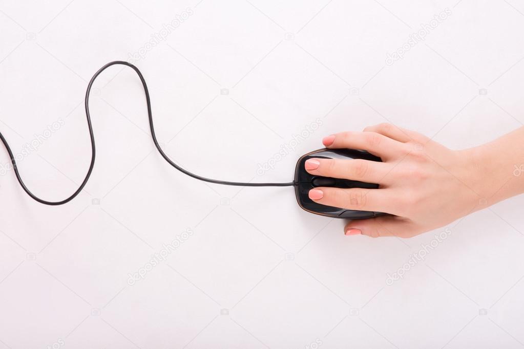 Female hand using PC mouse.