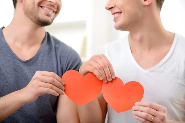 Loving homosexuals sitting on the sofa — Stock Photo, Image