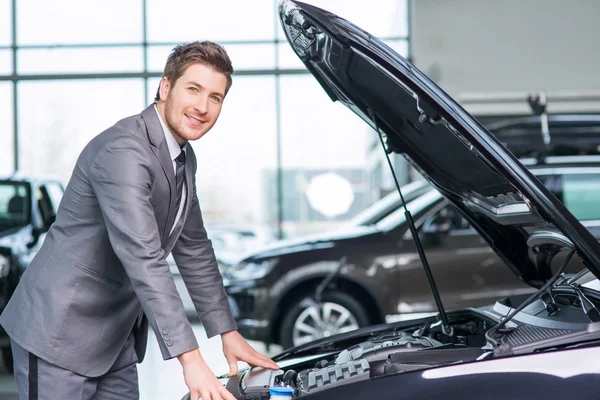 Professional sale assistant working  in auto show — Stock Photo, Image