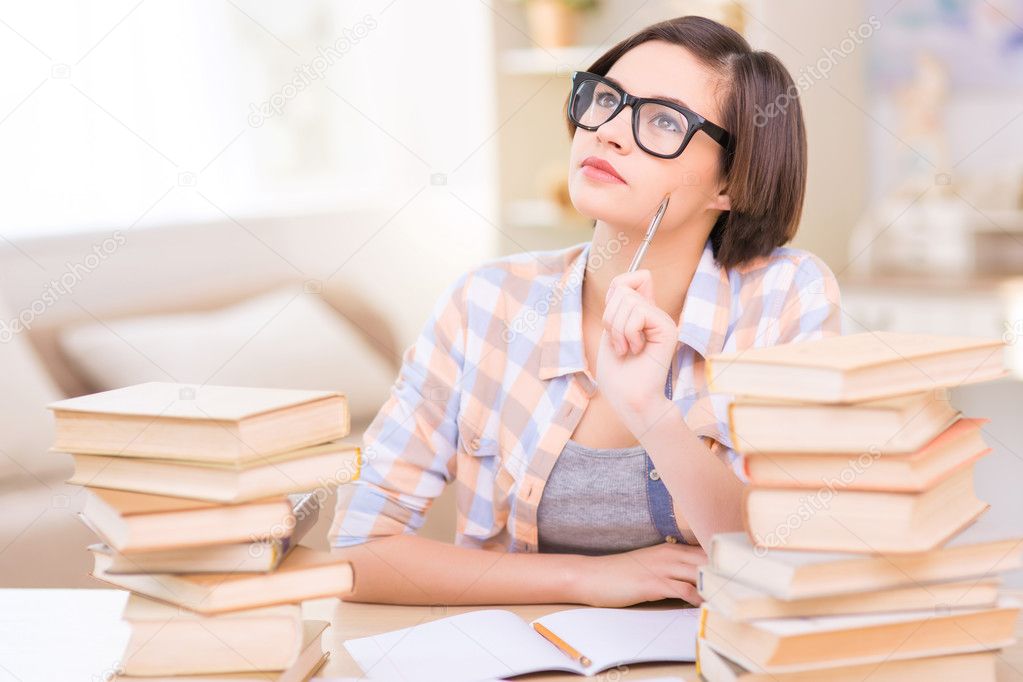 Female student is lost in thought.