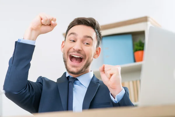 Emotional office worker sitting at the table — Stock Photo, Image