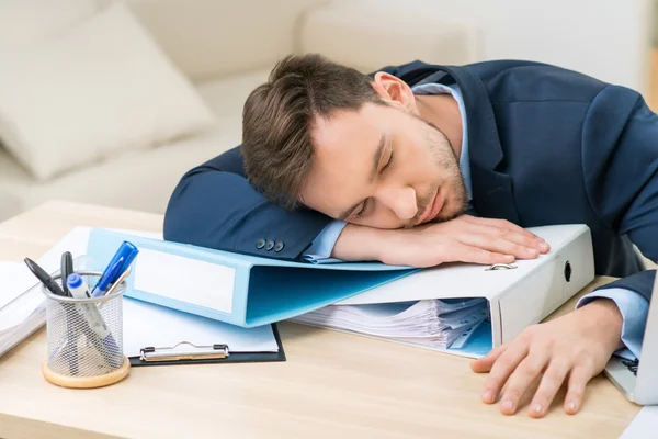 Nice worker sleeping at the table — Stockfoto