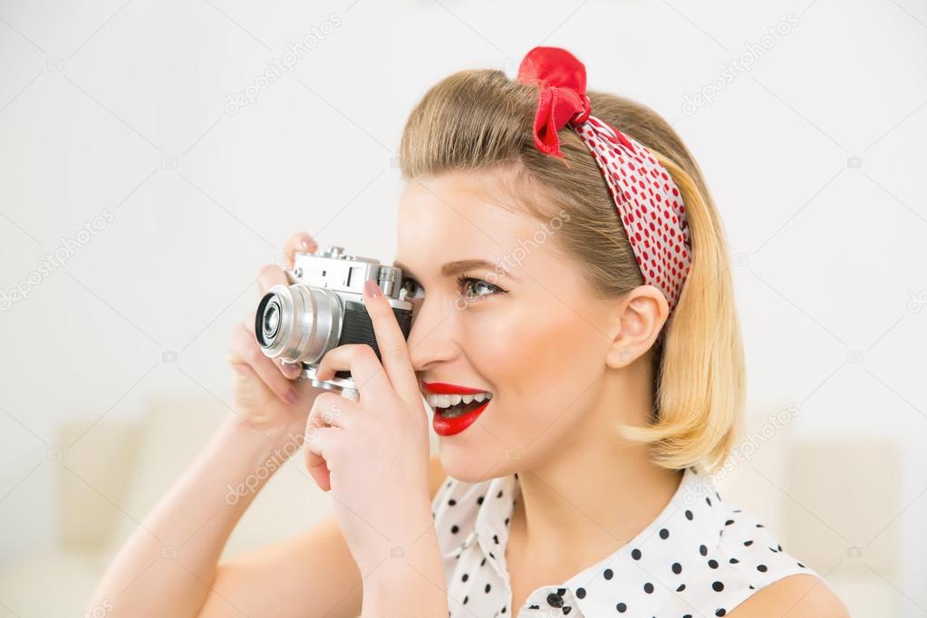Young attractive woman is taking a photo picture.