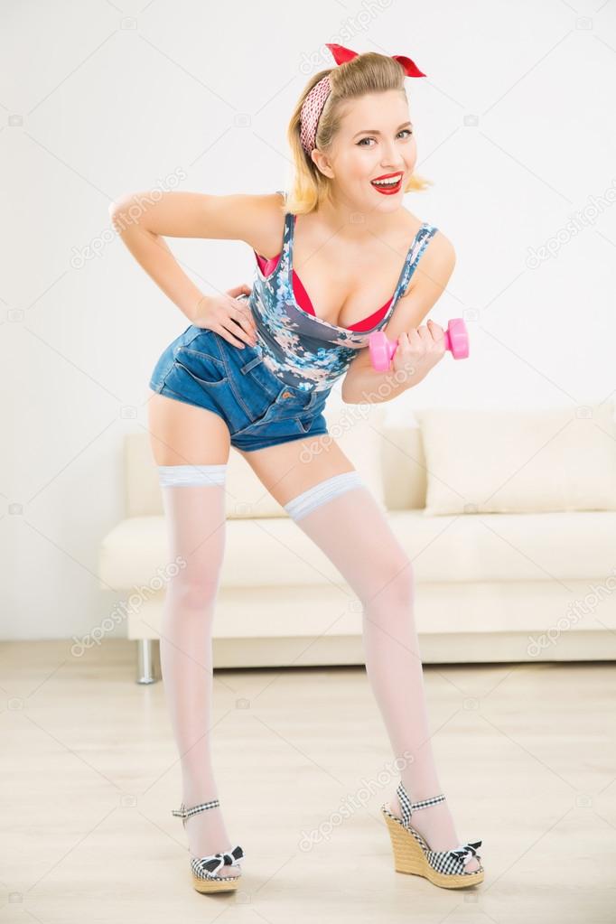 Young appealing woman is working out.