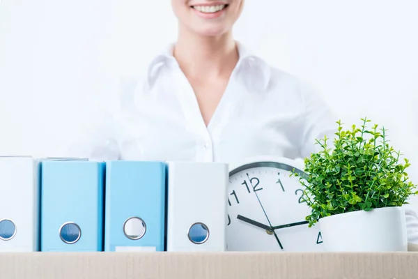 Pleasant woman holding box with things — Stock Photo, Image